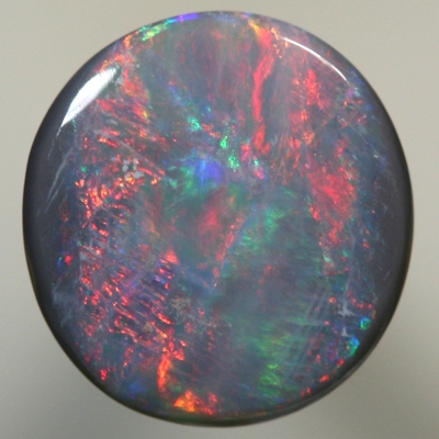 SOLID SEMI BLACK OPAL bright red moves over ocean blue green SEE VIDEO